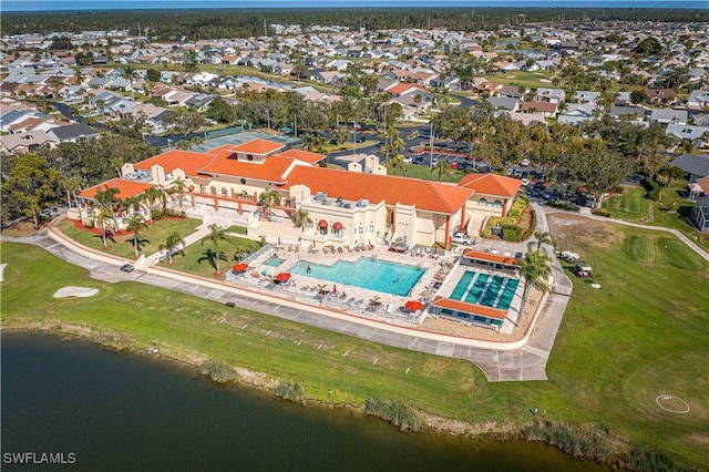 birds eye view of property with a water view and a residential view