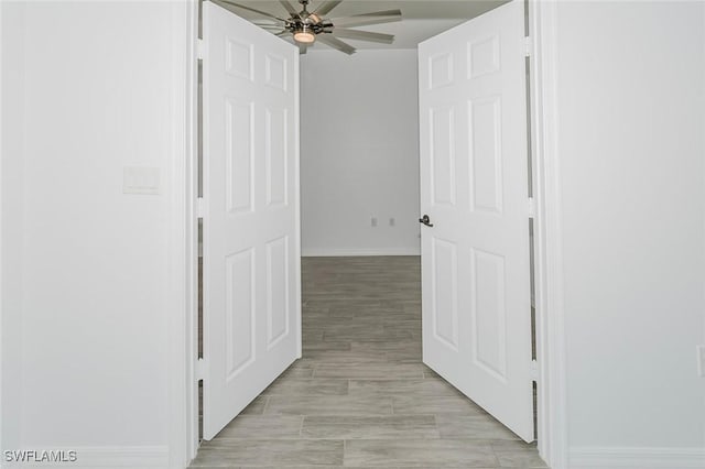 corridor featuring baseboards