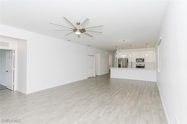 unfurnished living room featuring light wood-style flooring, visible vents, and a ceiling fan