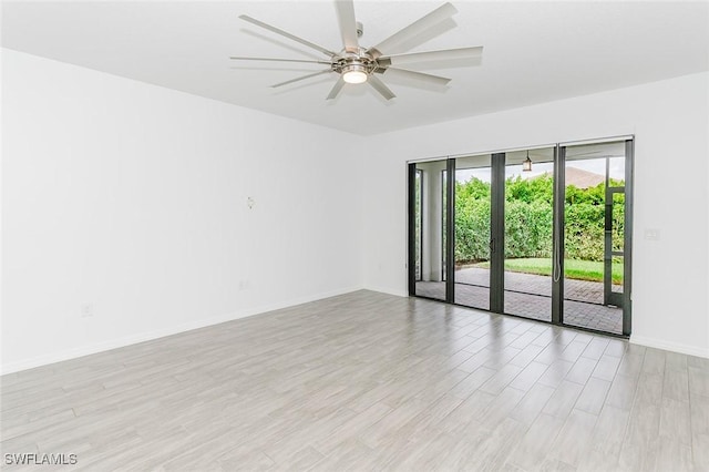 unfurnished room with light wood-type flooring, ceiling fan, and baseboards