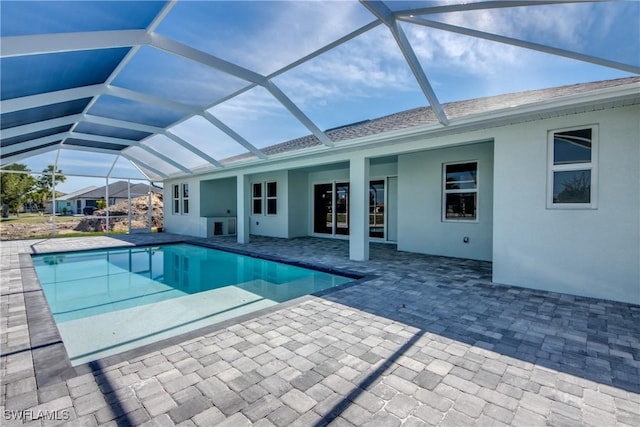 outdoor pool featuring a lanai and a patio area