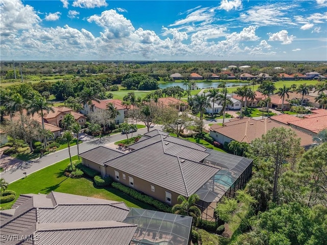 birds eye view of property with a water view and a residential view