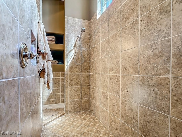 bathroom with tiled shower