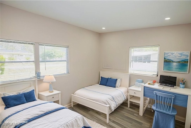 bedroom featuring baseboards, dark wood-type flooring, and recessed lighting