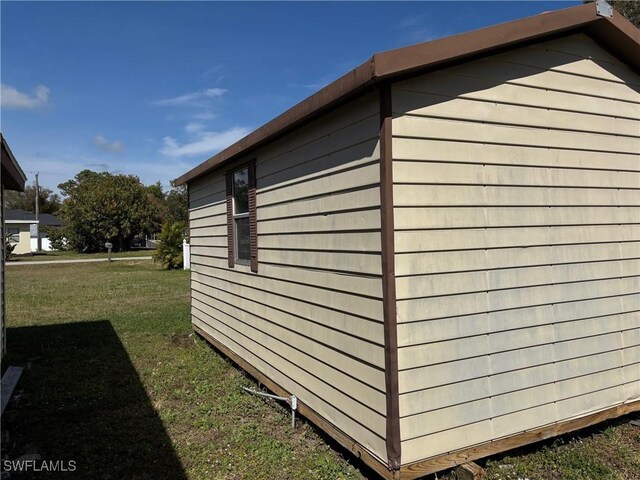 view of home's exterior featuring a yard