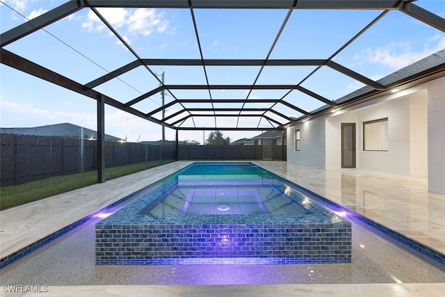 view of pool with a lanai, a patio area, a fenced backyard, and an in ground hot tub