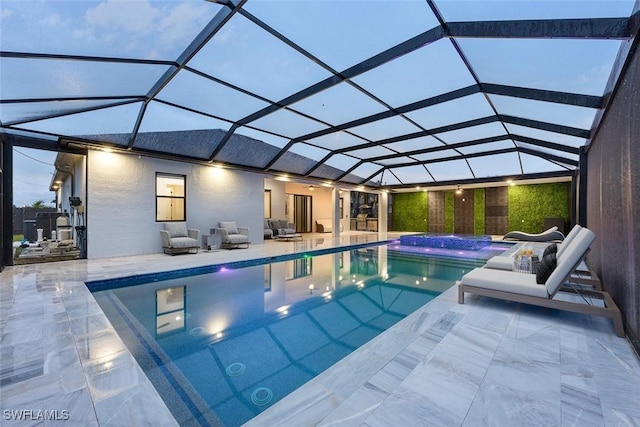 pool with a patio and a lanai