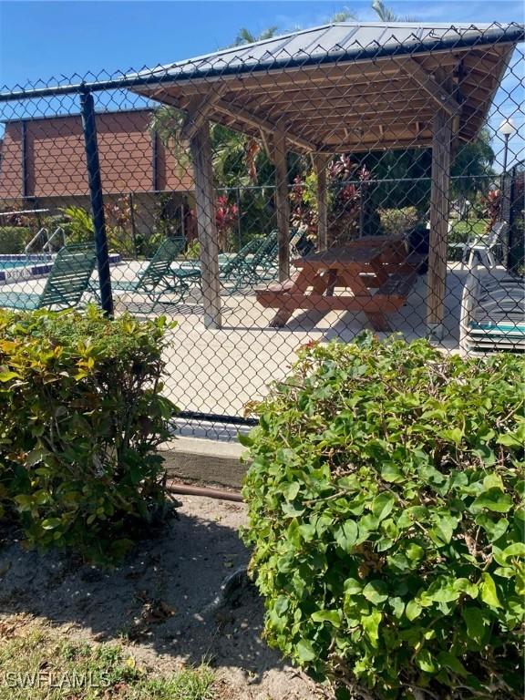 view of patio featuring fence