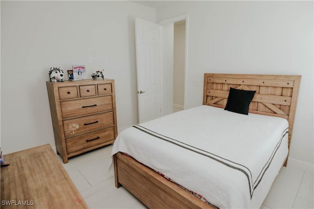 bedroom featuring light tile patterned floors