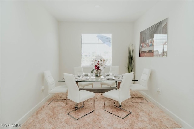 dining area featuring baseboards