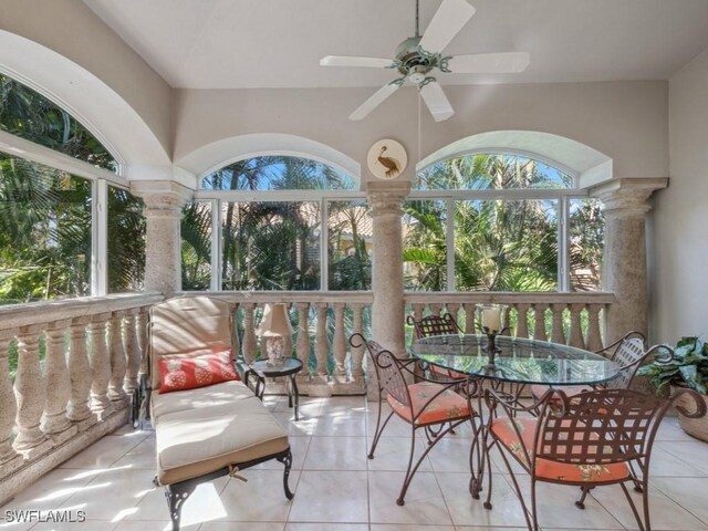 sunroom featuring ceiling fan