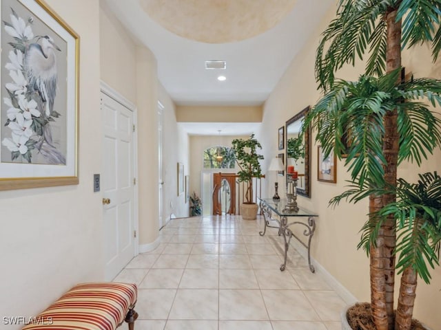 foyer featuring visible vents, baseboards, and light tile patterned floors