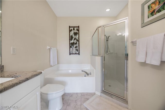 bathroom with vanity, a stall shower, tile patterned flooring, a garden tub, and toilet