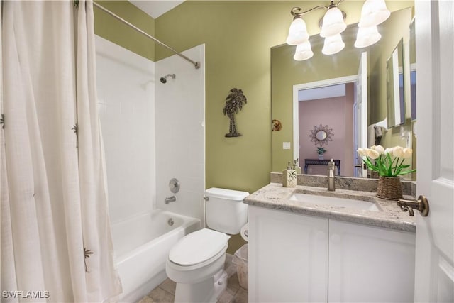 bathroom featuring shower / bath combo with shower curtain, a notable chandelier, vanity, and toilet