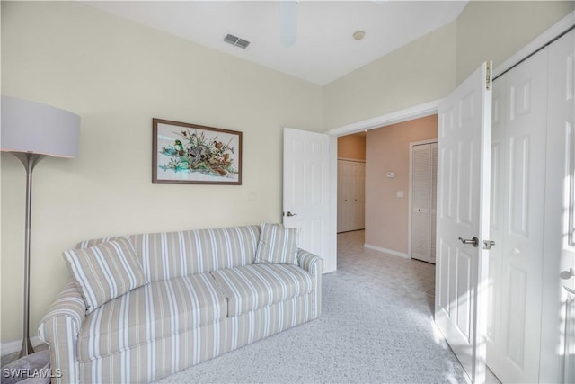 living room featuring visible vents and baseboards