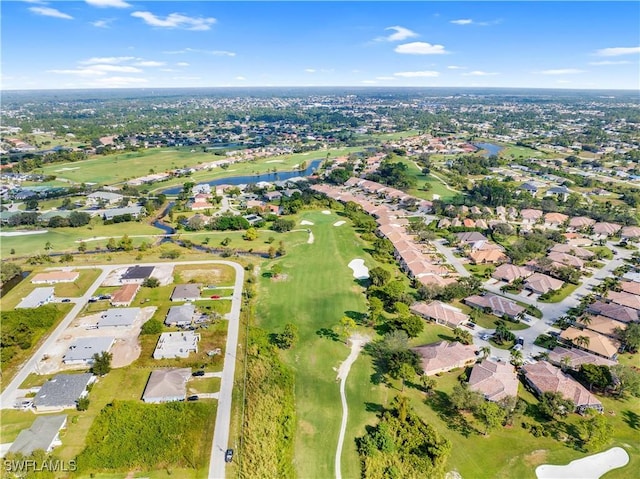 drone / aerial view featuring a residential view and golf course view