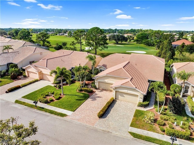 drone / aerial view featuring golf course view and a residential view