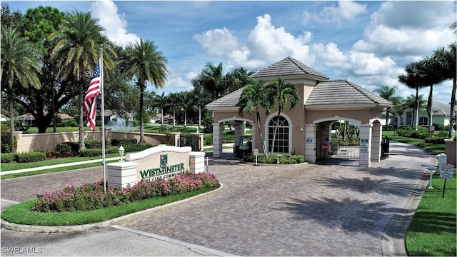 view of community with decorative driveway