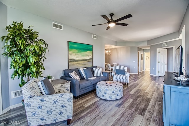 living room with visible vents and wood finished floors