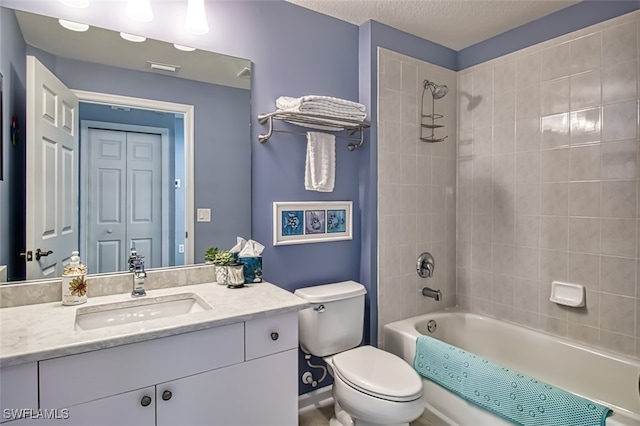 bathroom featuring shower / bath combination, toilet, a textured ceiling, vanity, and a closet