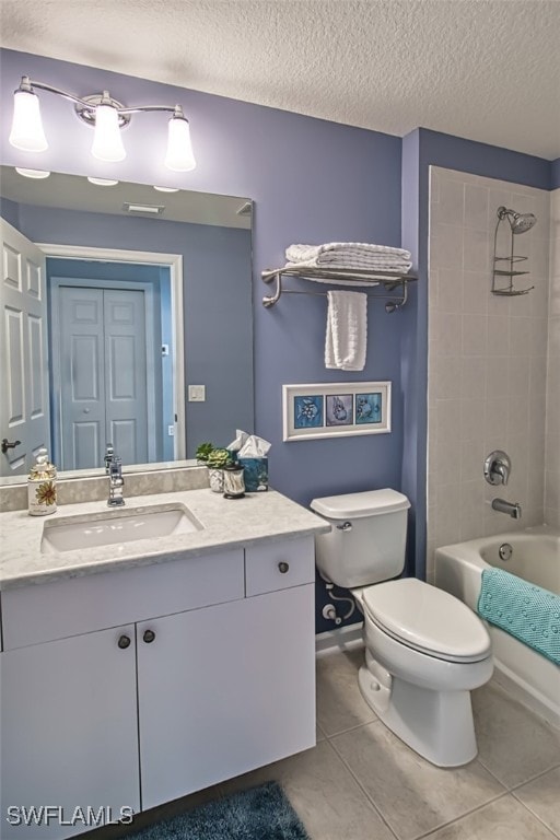 full bathroom with shower / bath combination, toilet, tile patterned floors, a textured ceiling, and vanity