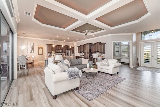 living room featuring light wood-style floors, visible vents, coffered ceiling, and french doors