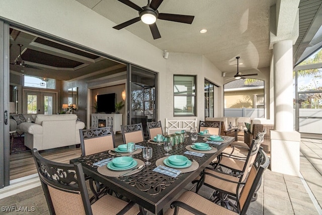 exterior space featuring outdoor dining space, outdoor lounge area, and ceiling fan