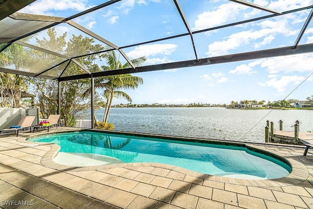 outdoor pool with a patio area, a lanai, and a water view