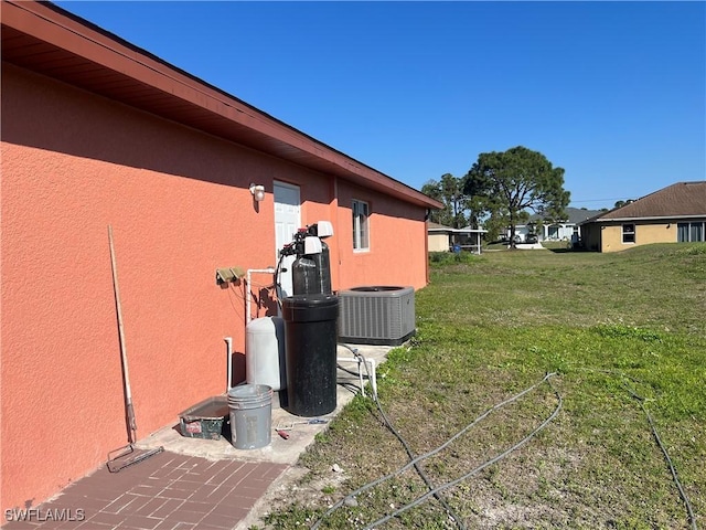 view of yard with central AC