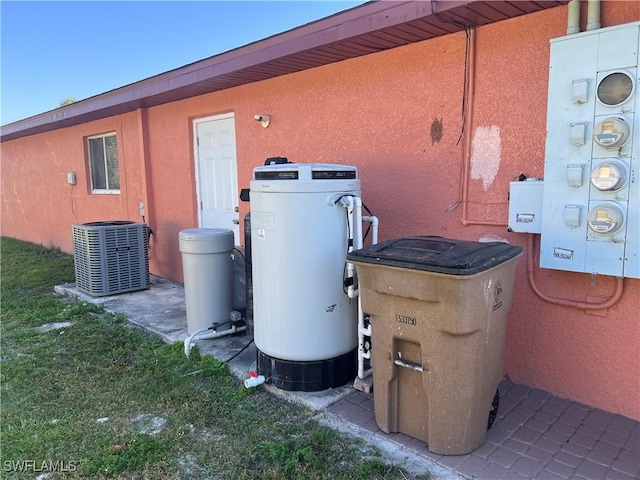 view of property exterior with stucco siding and central air condition unit