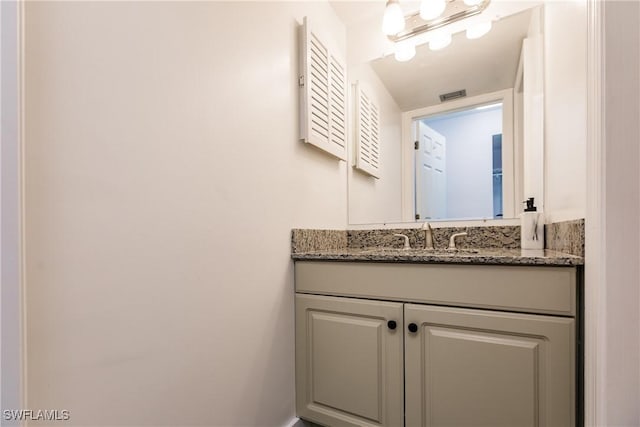 bathroom featuring visible vents and vanity