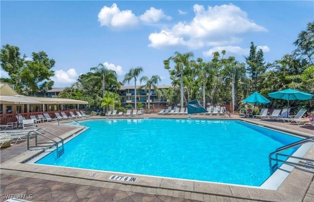 community pool with a patio area