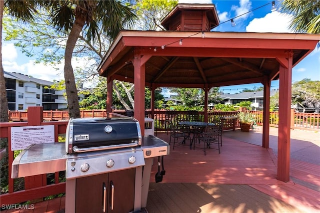 view of patio / terrace featuring a gazebo and a wooden deck