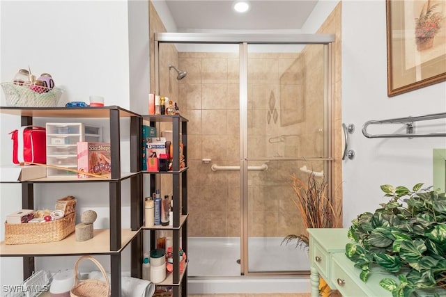 bathroom with a tile shower