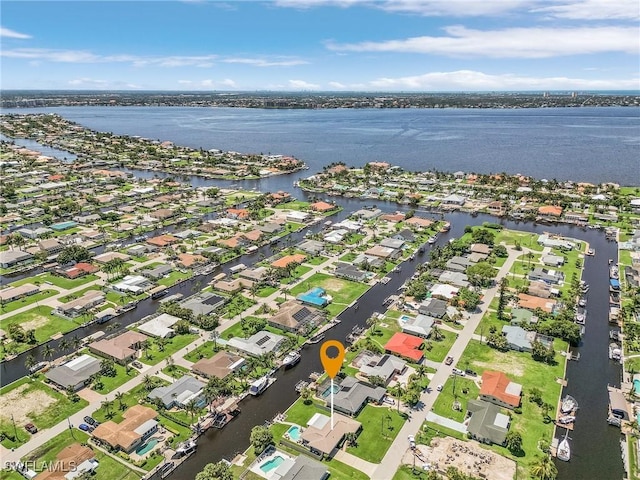 birds eye view of property featuring a residential view and a water view