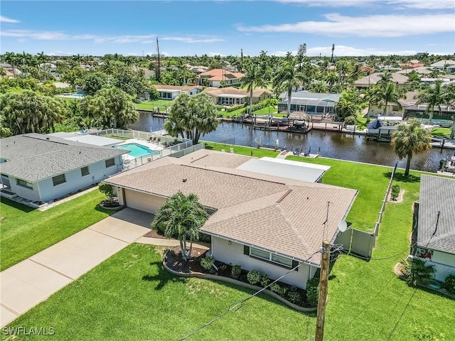 birds eye view of property featuring a residential view and a water view