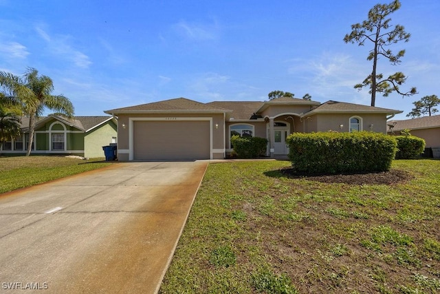 single story home featuring a garage, a front yard, concrete driveway, and stucco siding