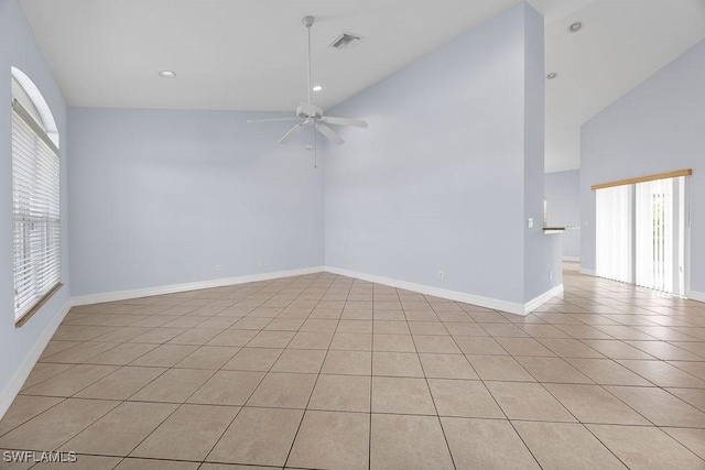 unfurnished room with baseboards, visible vents, a ceiling fan, high vaulted ceiling, and recessed lighting