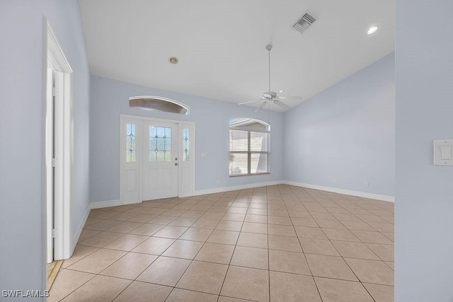 foyer entrance featuring ceiling fan, visible vents, baseboards, and light tile patterned flooring