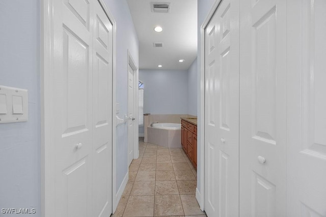 hallway with visible vents and recessed lighting