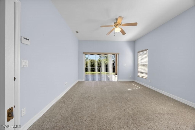 empty room with carpet, baseboards, and ceiling fan