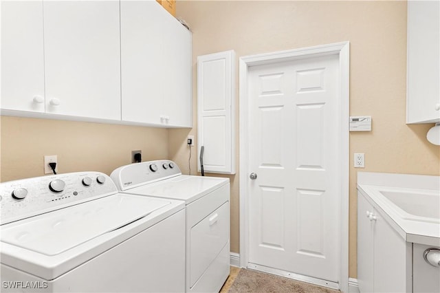 laundry area featuring washer and dryer and cabinet space