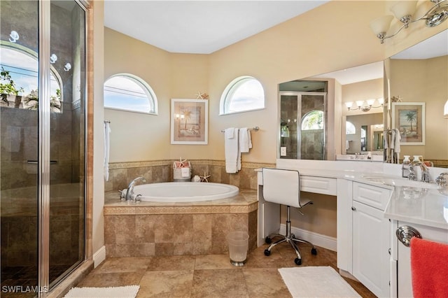 full bath with a garden tub, vanity, and a shower stall