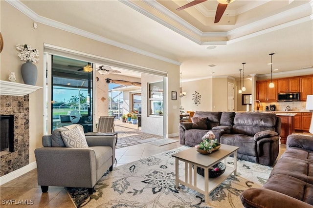 living area with light tile patterned flooring, a high end fireplace, and crown molding