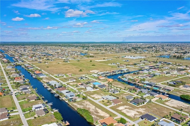 bird's eye view featuring a residential view and a water view