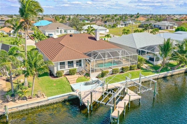 bird's eye view featuring a residential view and a water view