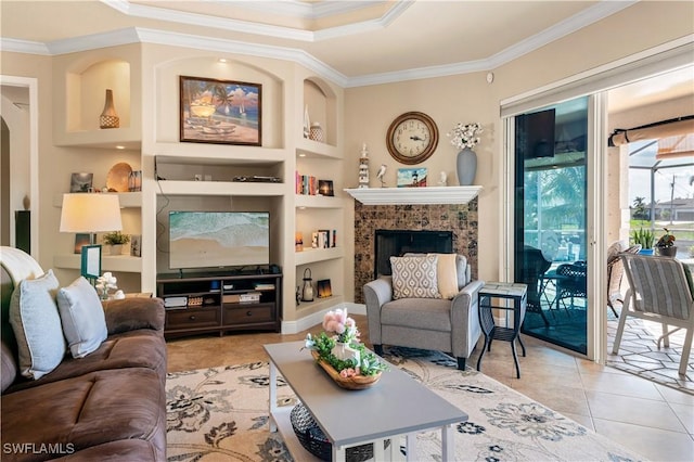 living room featuring light tile patterned floors, built in shelves, a fireplace, and ornamental molding