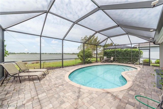 outdoor pool with a lanai and a patio