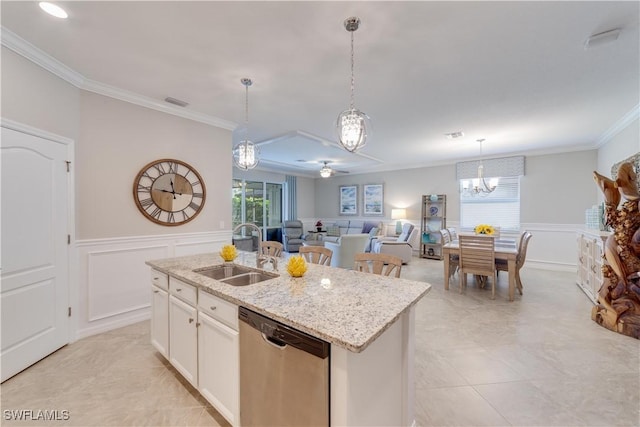 kitchen with white cabinets, open floor plan, a kitchen island with sink, stainless steel dishwasher, and a sink