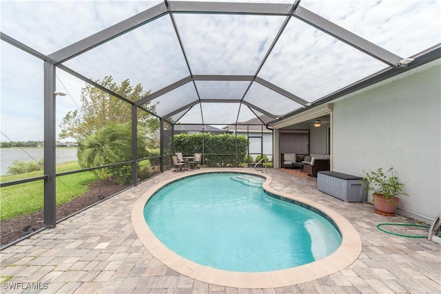 pool with glass enclosure, an outdoor living space, and a patio